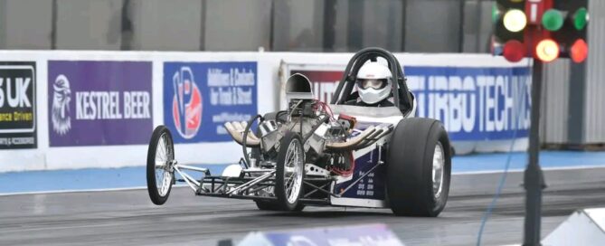 Wayne Colliver driving a Nostalgia Nationals car