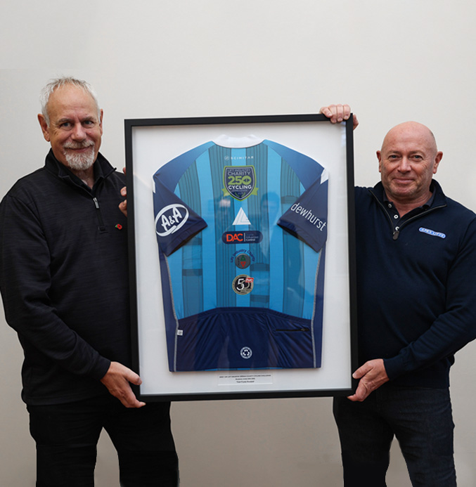 gary-poynter-csr-charity-social Gary Poynter of CSR charity social - employees holding a cycling shirt