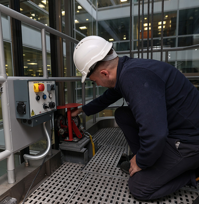 Lift engineer working in a lift shaft